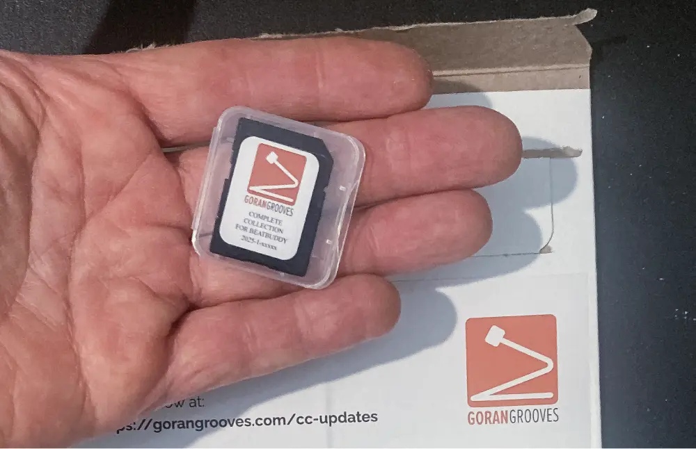 GoranGrooves Complete Collection loaded onto an SD card, shipped and received. Hand holding it.